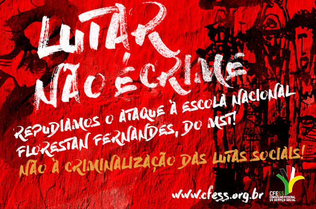Imagem mostra uma parede vermelha com os dizeres pichados Lutar não é crime e desenhos de trabalhadores rurais 